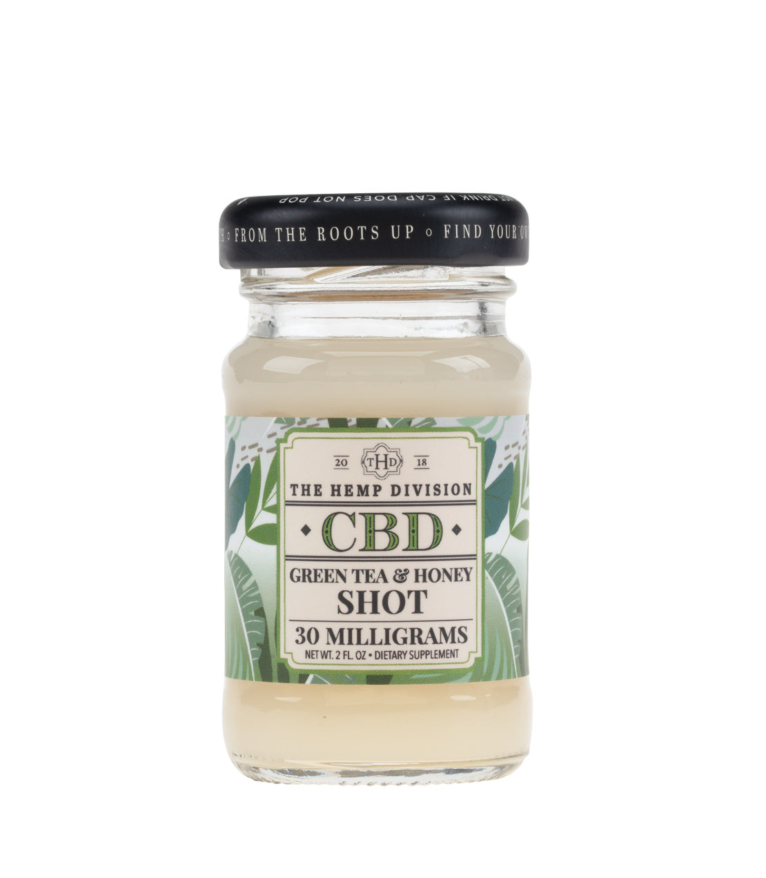 Green Tea & Honey CBD shot in a glass jar, featuring 30 mg of CBD, with a decorative label and black lid.