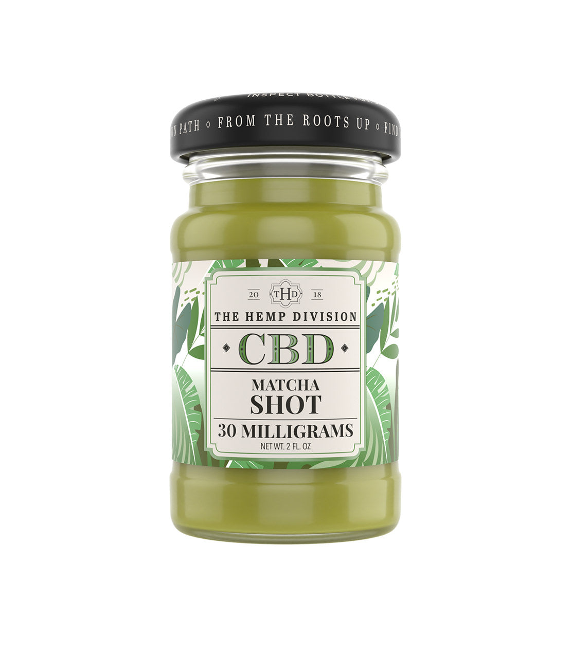 A glass jar of The Hemp Division CBD Matcha Shot tincture with a black screw cap and a white tropical leaf-patterned label, shown on a solid white background.